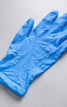 Blue nitrile examination glove